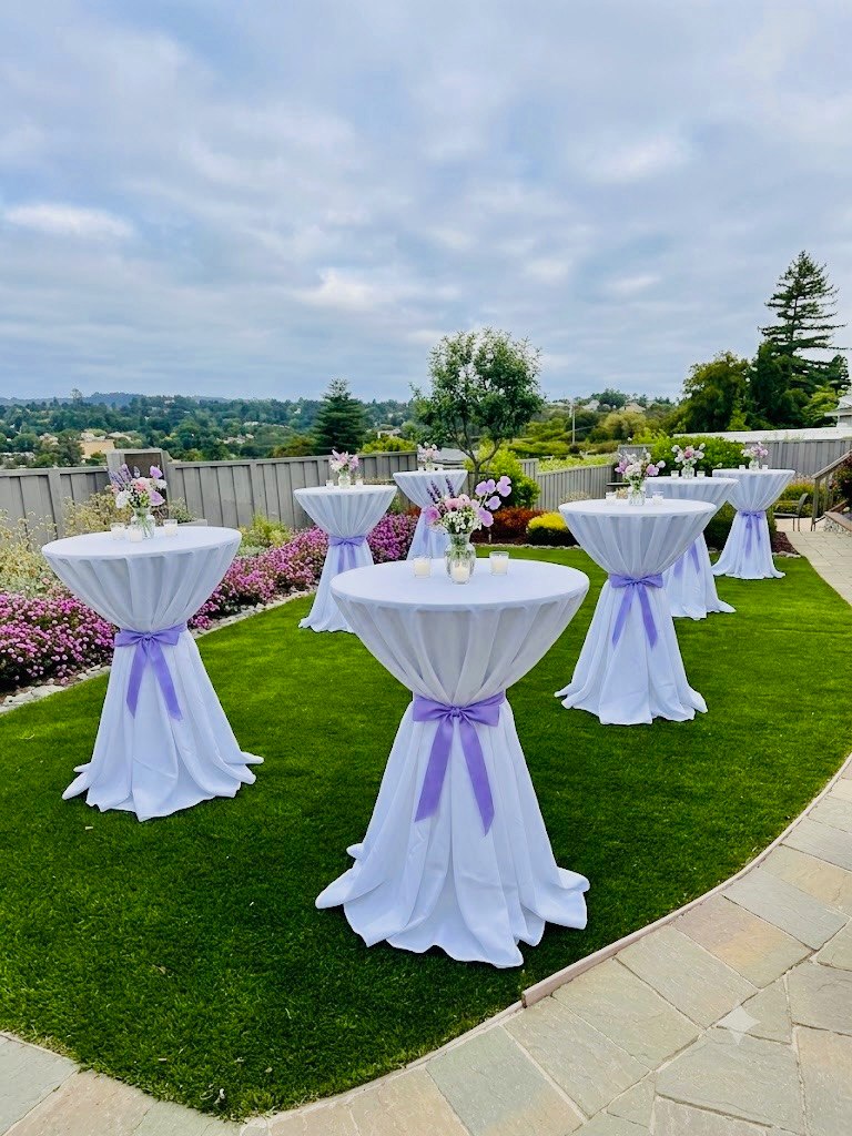 Keller's cocktail tables with lavender accents in a garden setting